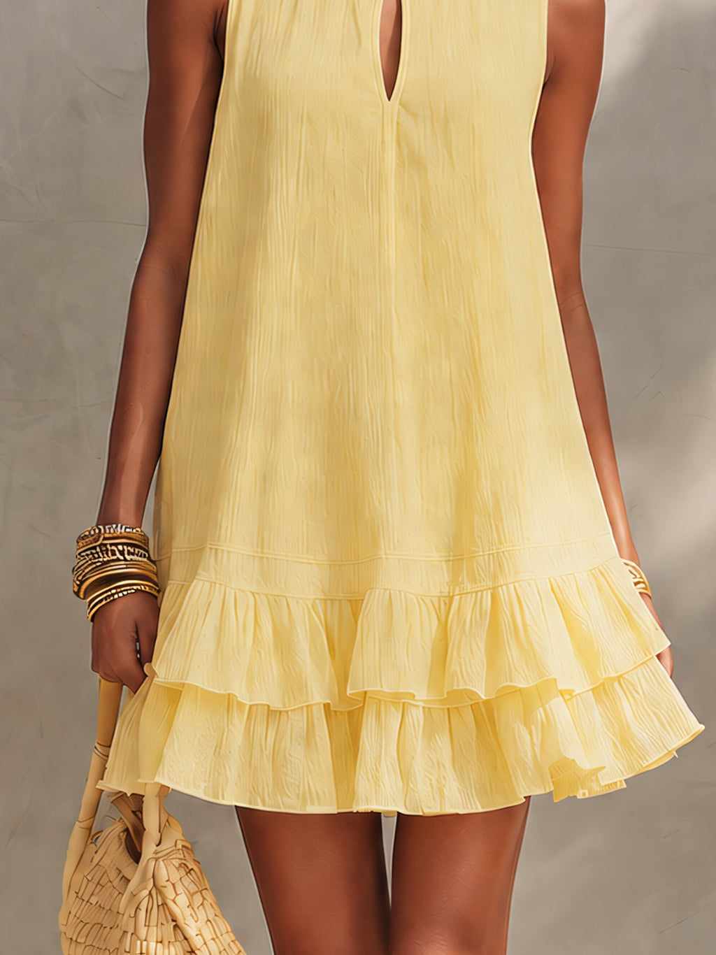 Vestito mini giallo testurizzato senza maniche con orlo a volant