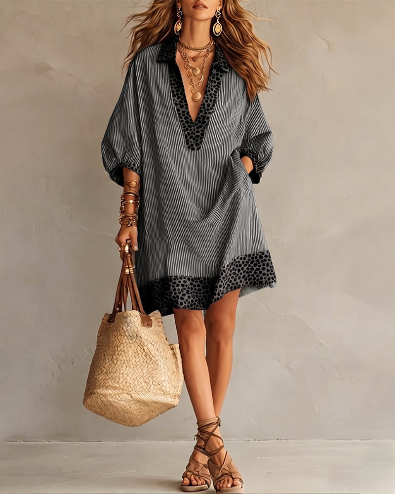 Vestido con paneles estampados de leopardo, mangas abullonadas y camisa a rayas.