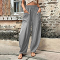 Vanna - Pantaloni fluidi a gamba larga con tasche a patta e vita elastica